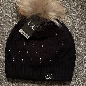 NWT Brand new, never worn C.C Black sparkly Beanie with Tan Faux Fur Pom